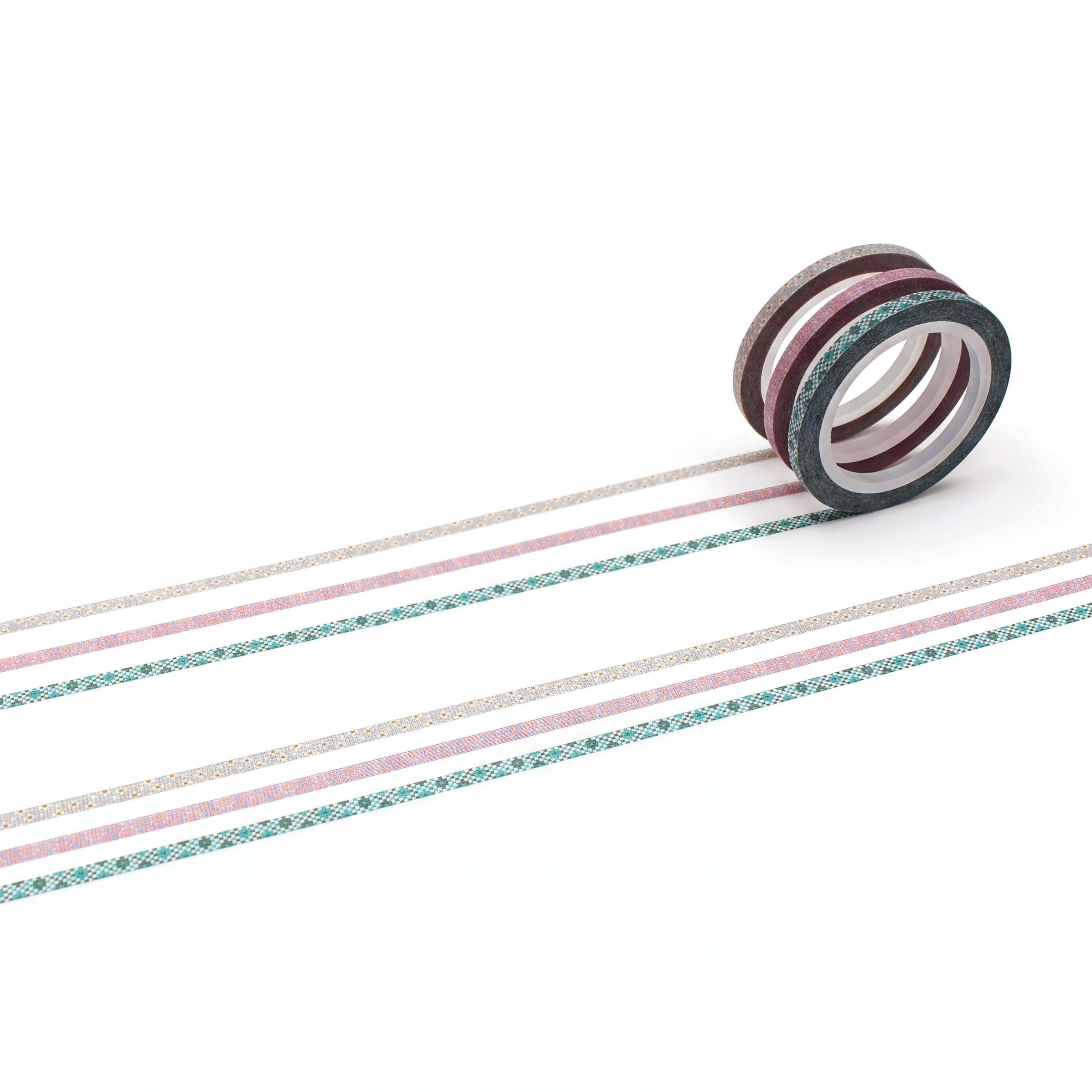 A roll of colorful washi tape is lying on a white surface, with a series of horizontal stripes in various colors visible.
