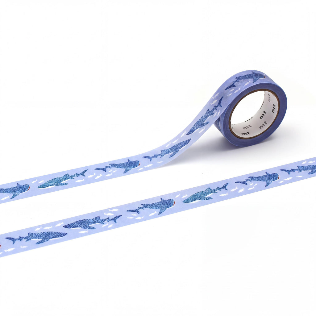 a roll of blue and white patterned tape with a repeating design of blue sharks on it.