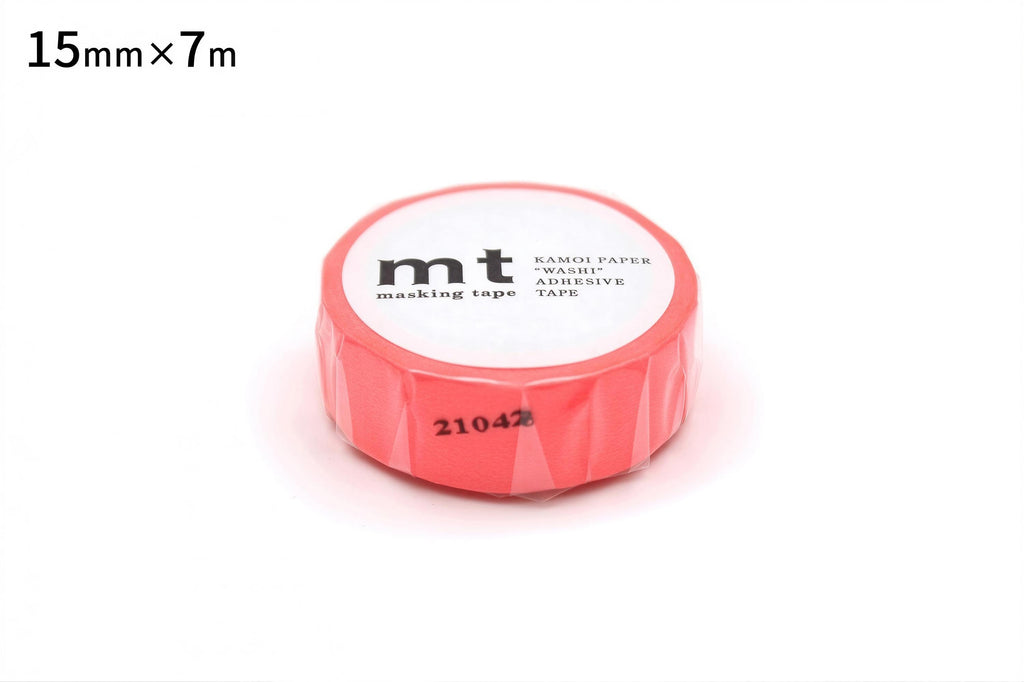 A roll of red masking tape with the label "mt" printed on it.