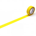 A yellow roll of tape is lying on a white surface, with a single yellow line running across it.