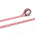 a roll of red and white floral patterned tape on a white background.