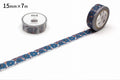 a roll of blue and white patterned tape with a floral design, placed next to a roll of tape with a similar floral design.