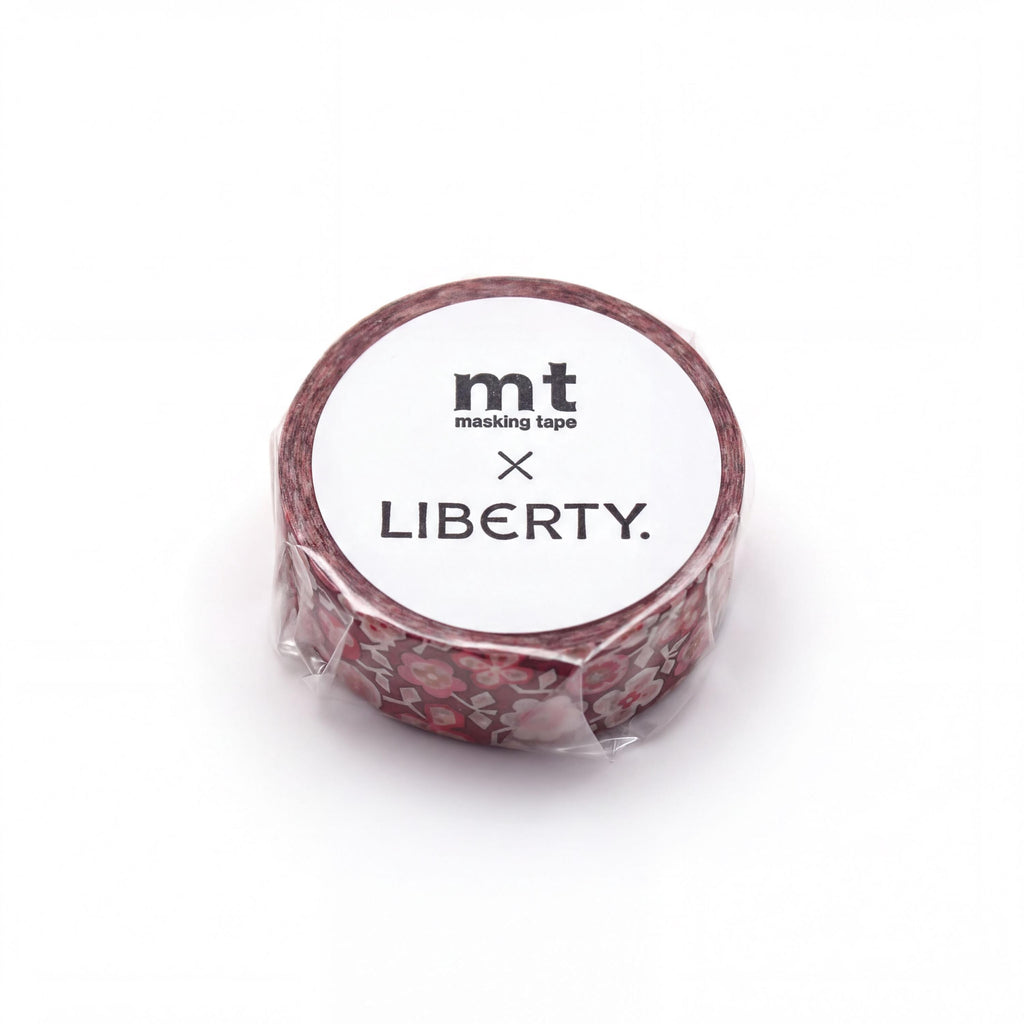A roll of red and white patterned masking tape with the text "mt masking tape LIBERTY" printed on it.